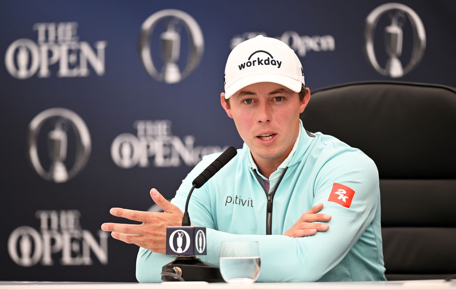 Matt Fitzpatrick of England looks on as they are interviewed prior to The 151st Open at Royal Liverpool Golf Club on July 17, 2023 in Hoylake, England.